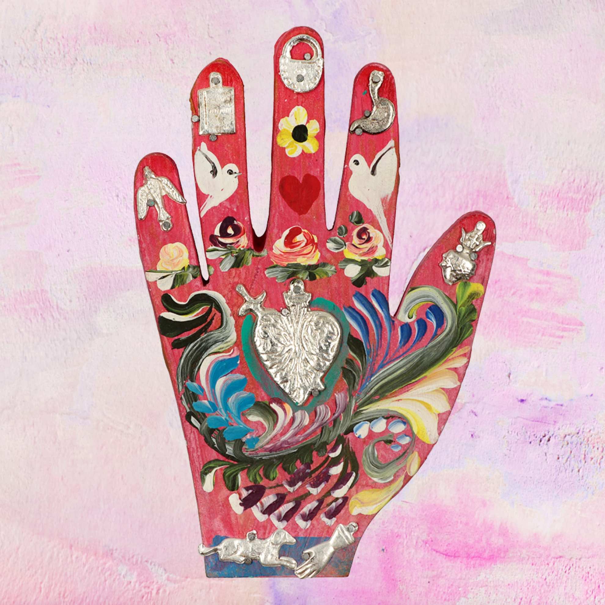 Wooden hand with Milagros