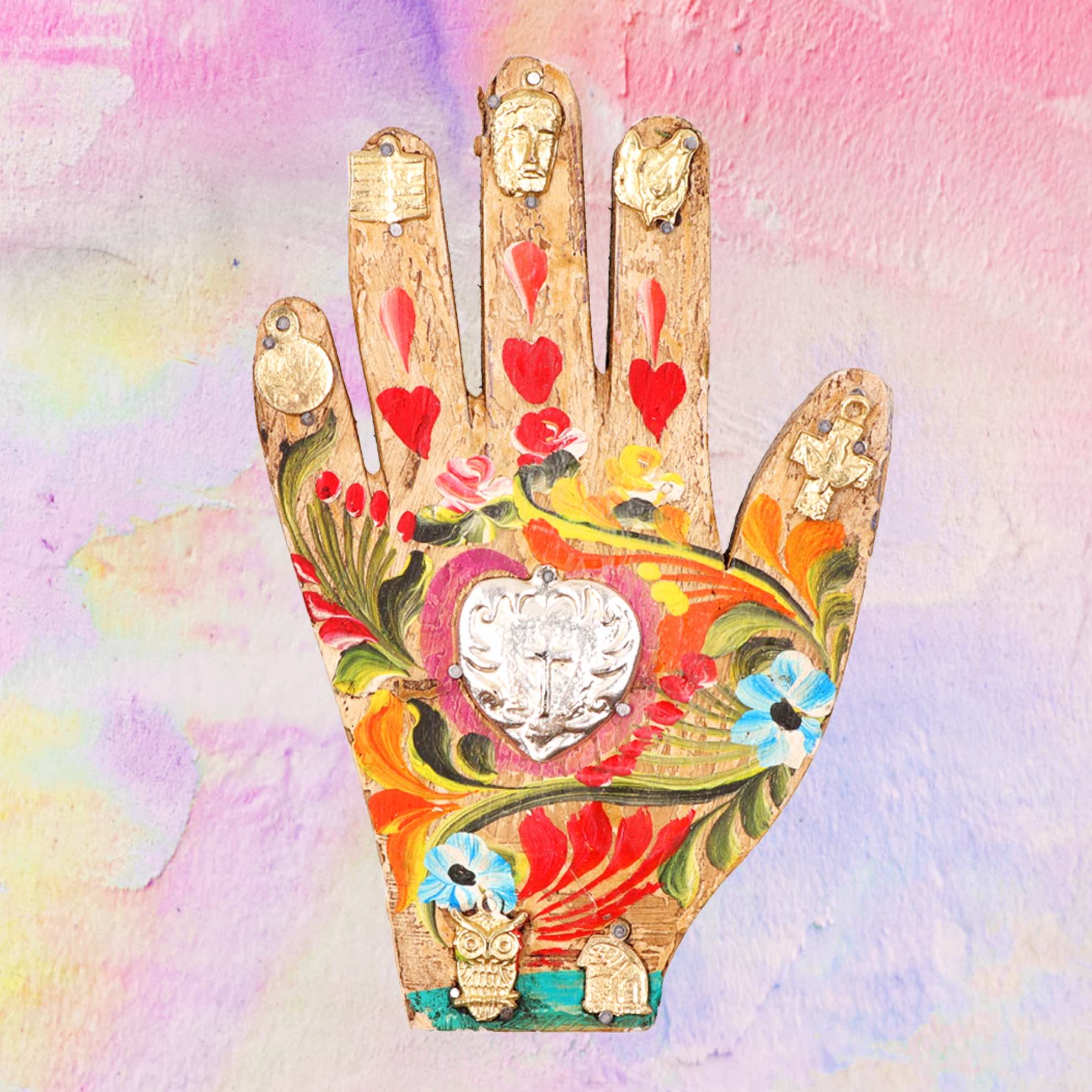 Wooden hand with Milagros