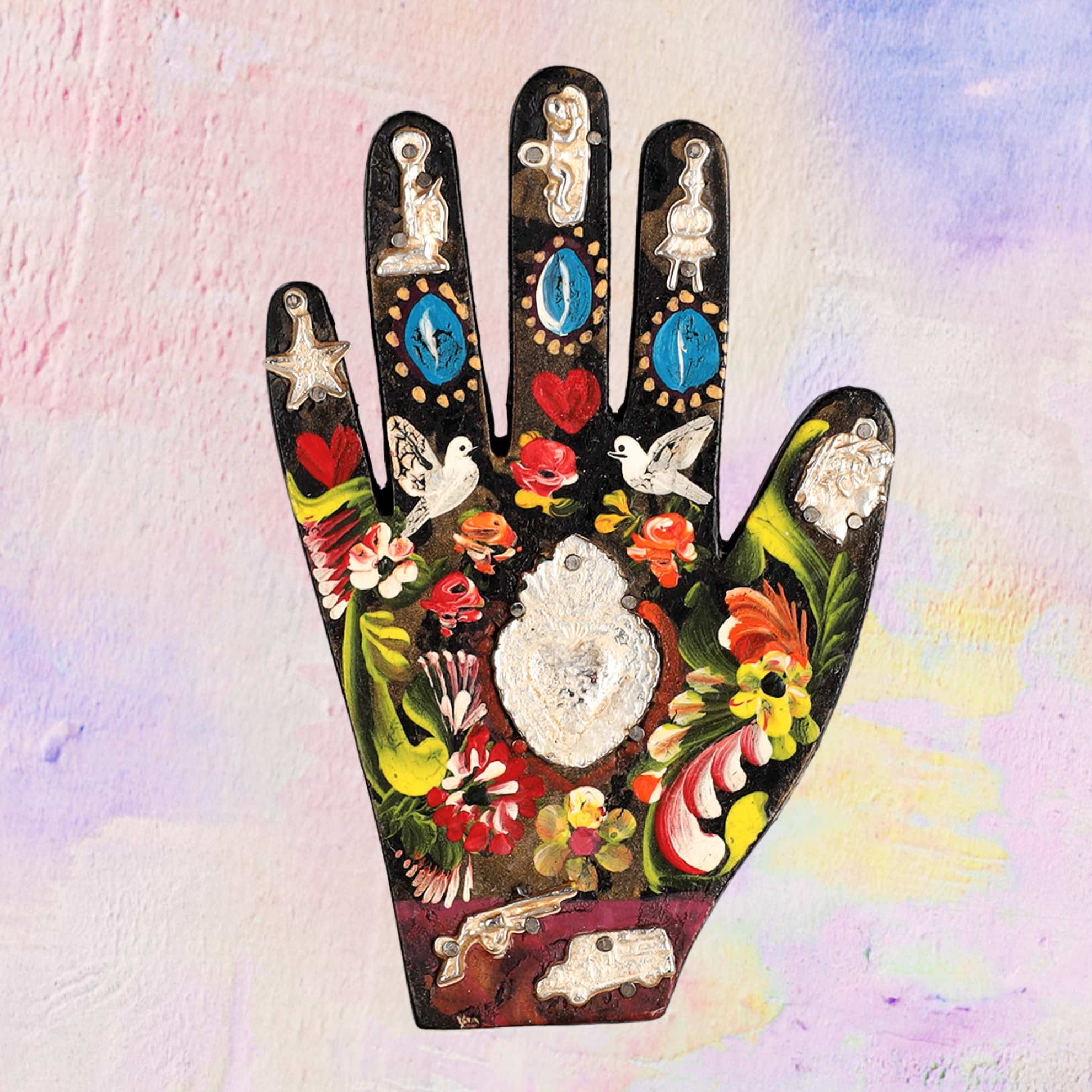 Wooden hand with Milagros