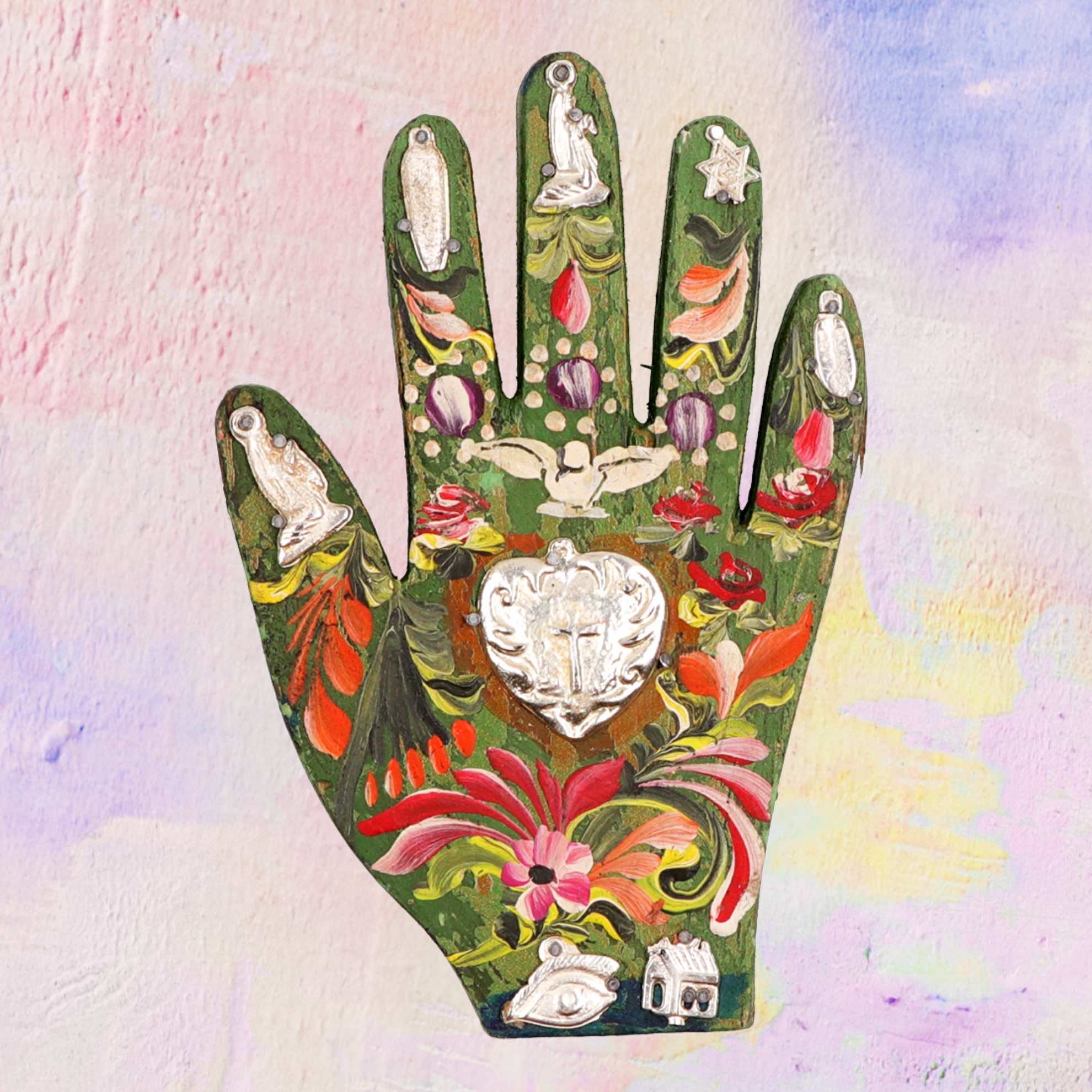 Wooden hand with Milagros